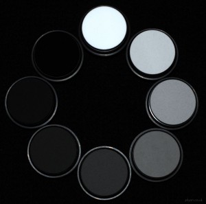 This photo shows a set of grey standards we use to linearise cameras, with reflectance values ranging from 2% to 99%. They are made a spectralon - one of the most diffuse substances known - basically non-stick plastic that's been powdered and squished together with a bit of heat (sintered), then mixed with charcoal to get the grey level.